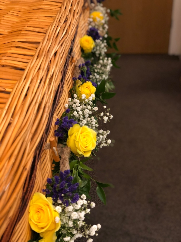 Coffin dressing roses, static and gypsophilia