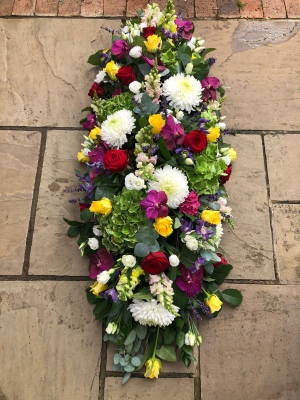 Multi coloured coffin spray